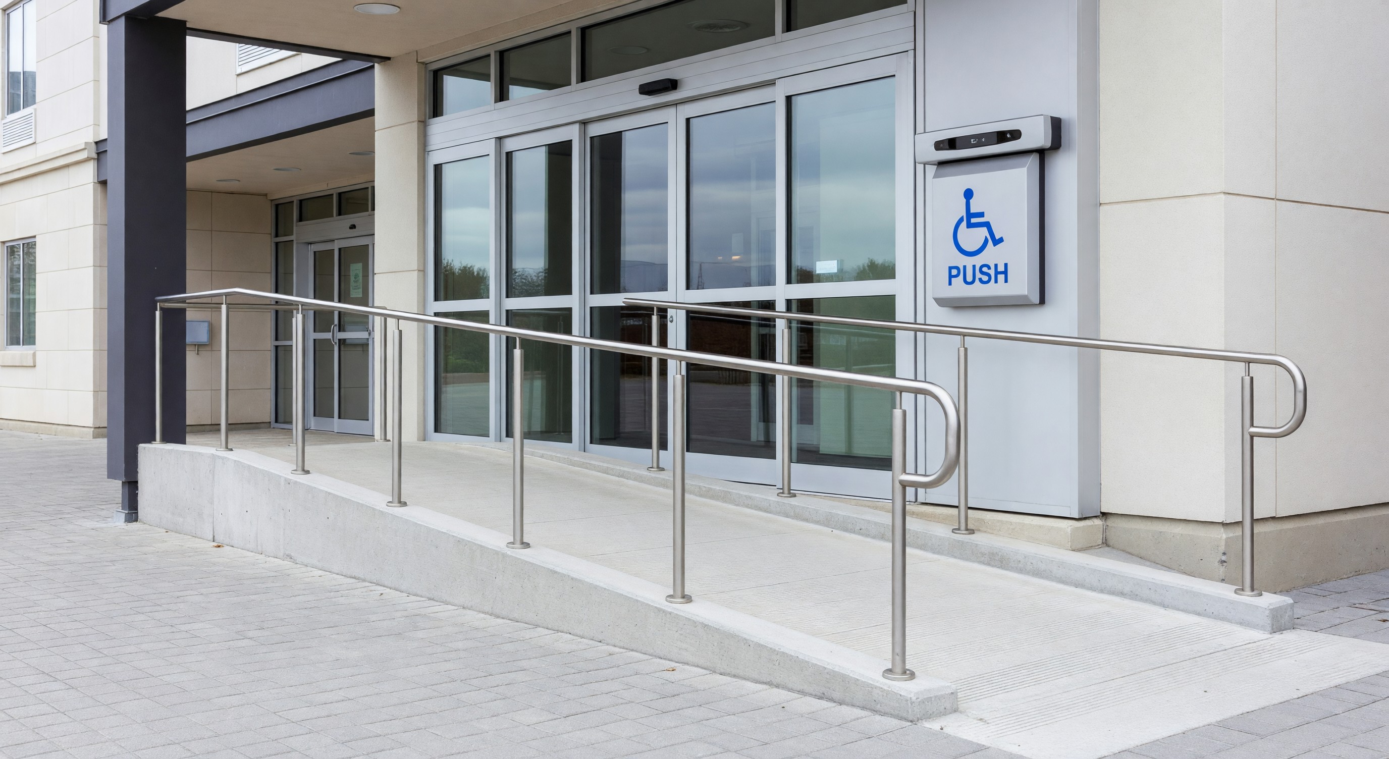 Hotel accessible entrance with ramp and automatic door opener