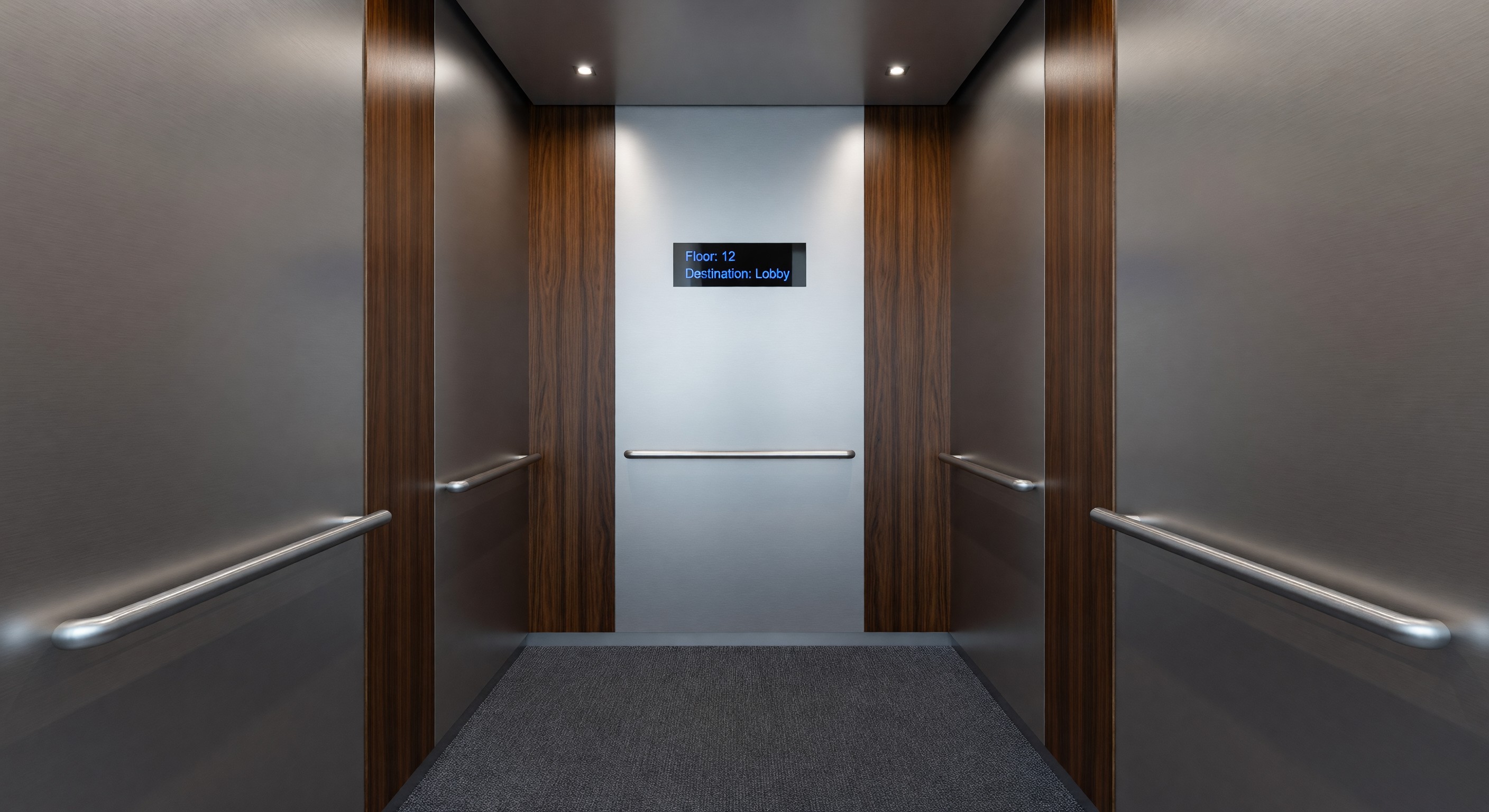 Modern hotel elevator cab interior with updated finishes and digital display