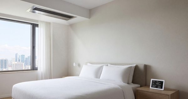 Hotel room with fresh air ventilation and air quality monitoring