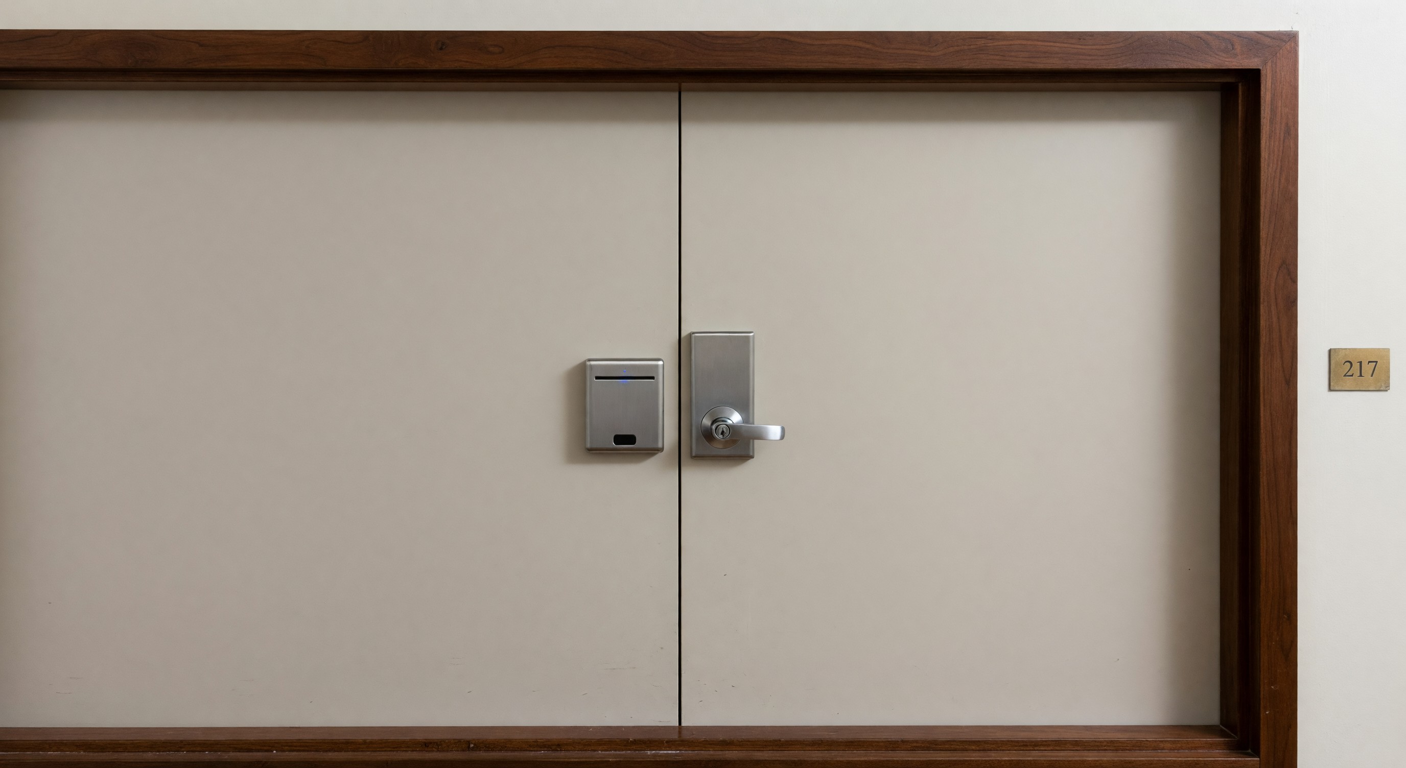 Hotel room door with electronic key card reader