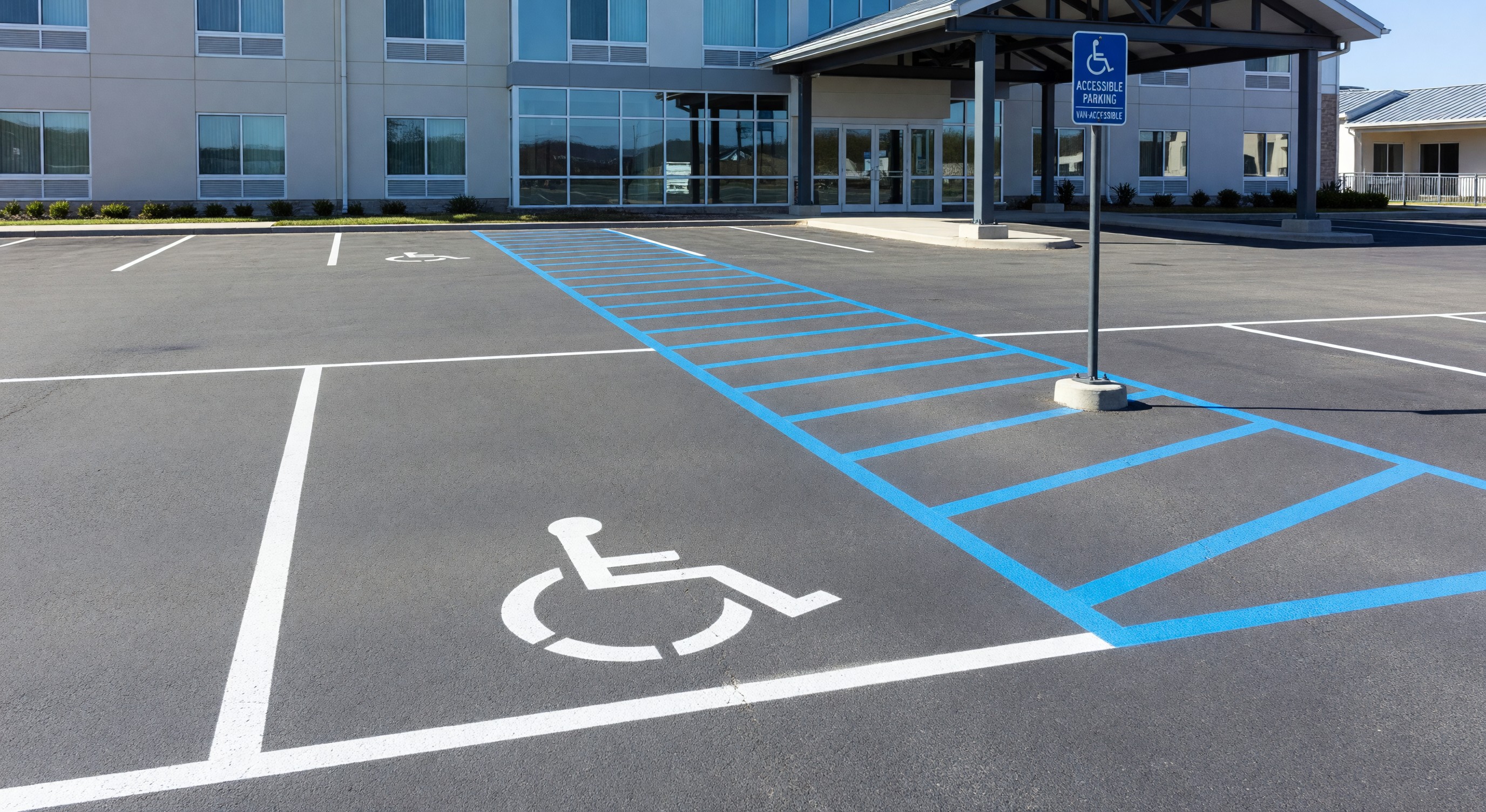 Accessible parking space with van-accessible access aisle at hotel parking facility