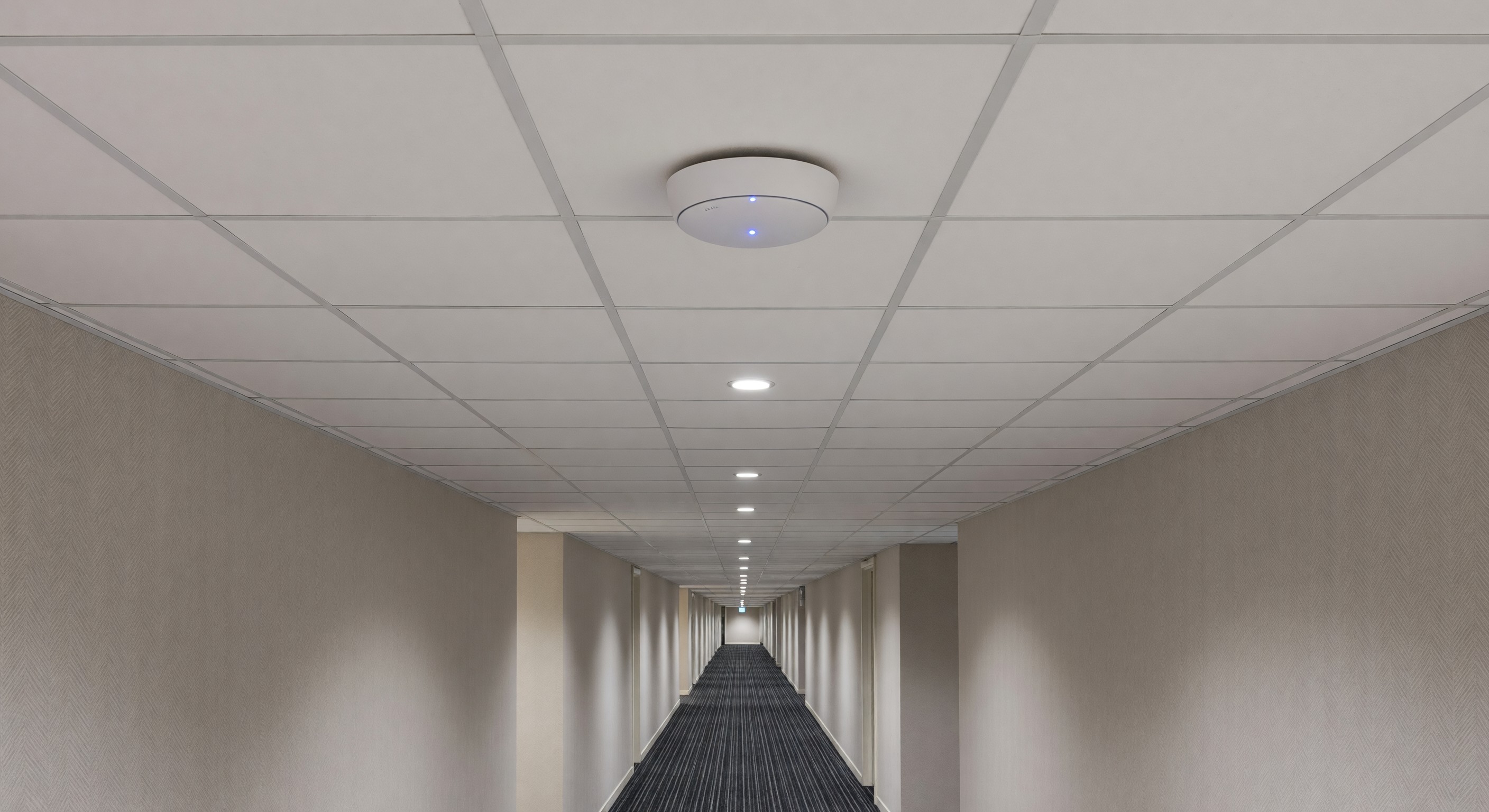 Hotel corridor with ceiling-mounted wireless access point